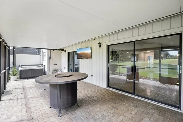 a front view of a house with a garden and plants