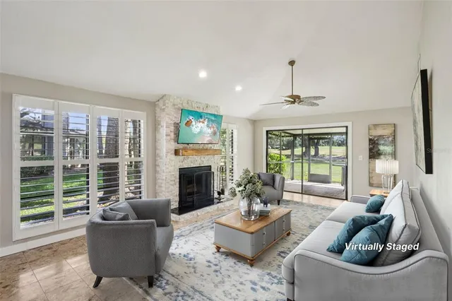 a living room with furniture and a fireplace