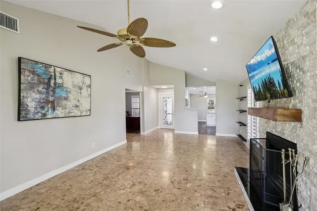 a view of an empty room with a fireplace