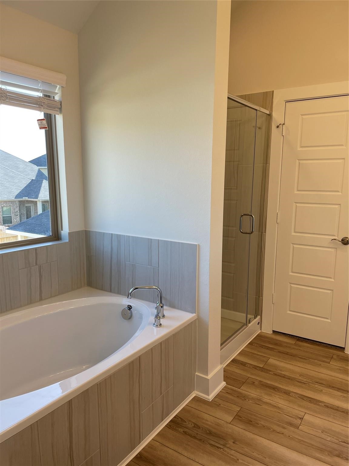 10638 Whitejacket Conroe, TX 77385 - Photo 9 of 25 a bathroom with a bathtub and a shower