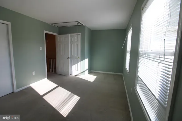 an empty room with wooden floor