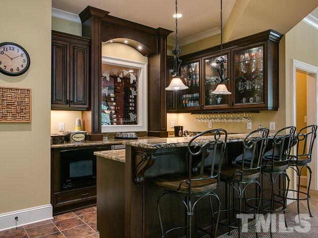 2309 Mt Vernon Church Road Raleigh, NC 27614 - Photo 19 of 25 a kitchen with a sink a stove and cabinets