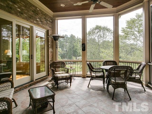 2309 Mt Vernon Church Road Raleigh, NC 27614 - Photo 23 of 25 a view of a work space with furniture and floor to ceiling windows