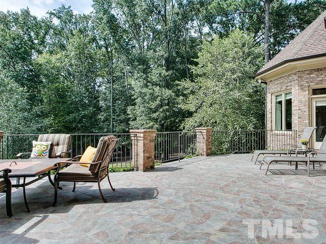 2309 Mt Vernon Church Road Raleigh, NC 27614 - Photo 24 of 25 a view of a patio with a table and chairs