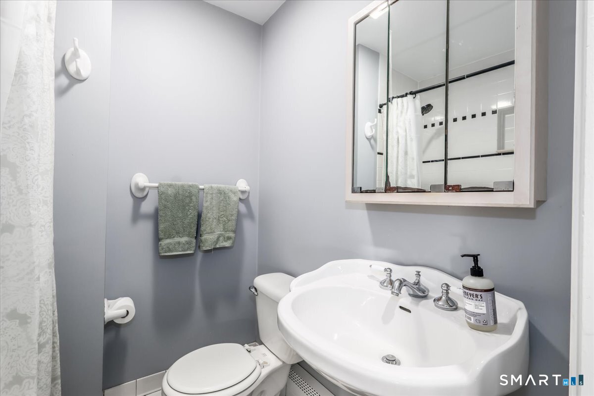 19 Botsford Hill Road Newtown, CT 06470 - Photo 24 of 40 a bathroom with a sink toilet and mirror