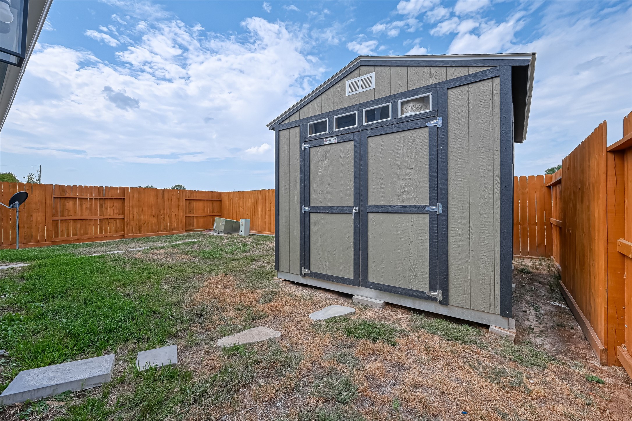 6906 Anson Point Lane Houston, TX 77040 - Photo 29 of 31 a view of a small house with a large parking space