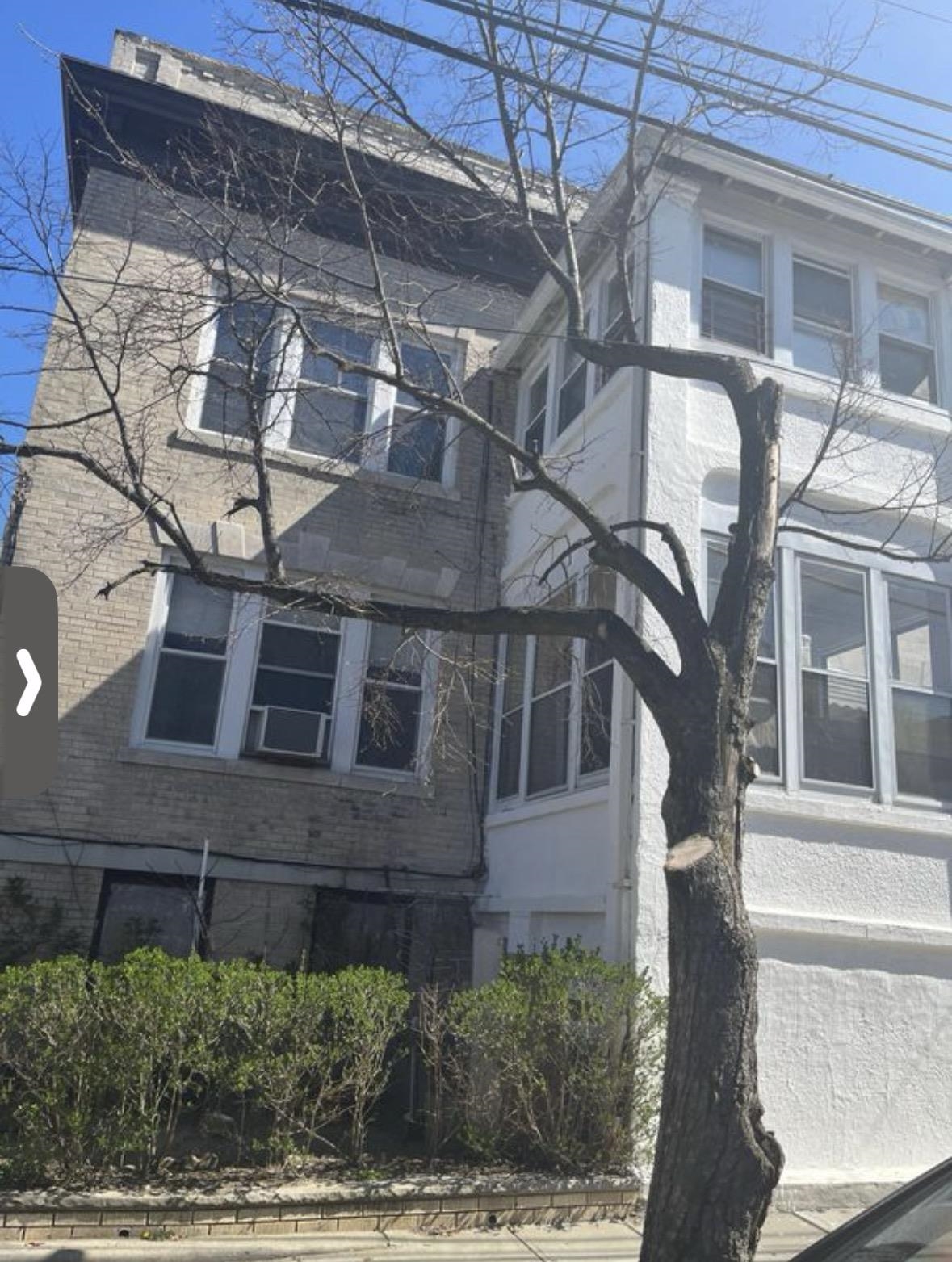 46 Liberty Place, Unit 2 Weehawken, NJ 07086 - Photo 1 of 6 a view of a brick building with a large windows