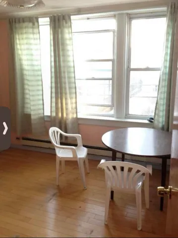 a white bath tub sitting next to a window