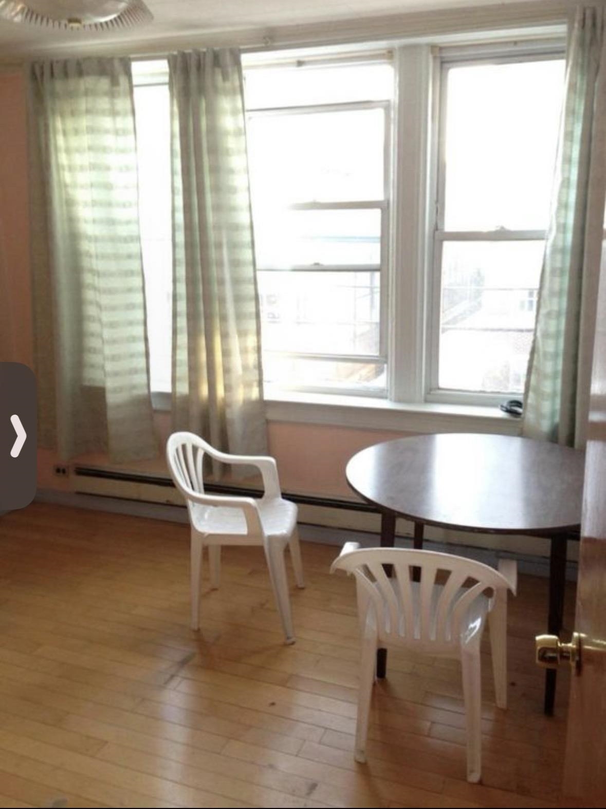46 Liberty Place, Unit 2 Weehawken, NJ 07086 - Photo 2 of 6 a white bath tub sitting next to a window