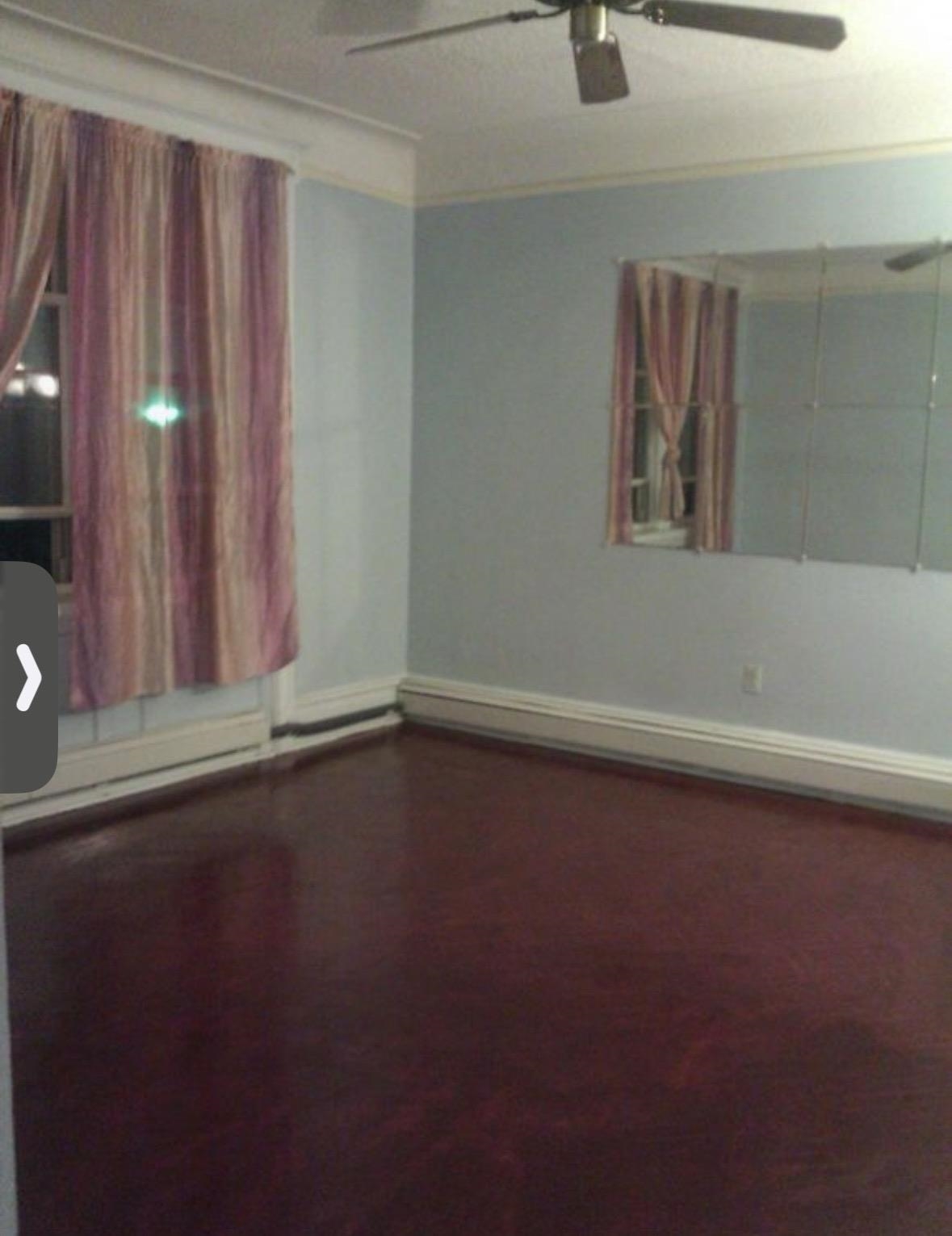 46 Liberty Place, Unit 2 Weehawken, NJ 07086 - Photo 3 of 6 a view of a livingroom with wooden floor and a window