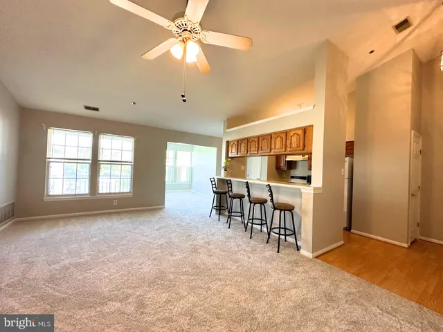 a view of a livingroom with furniture window and wooden floor