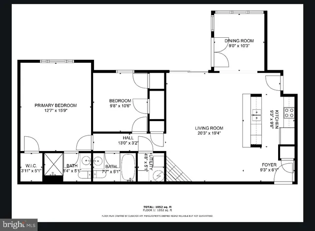 a front view of a residential apartment building with a yard