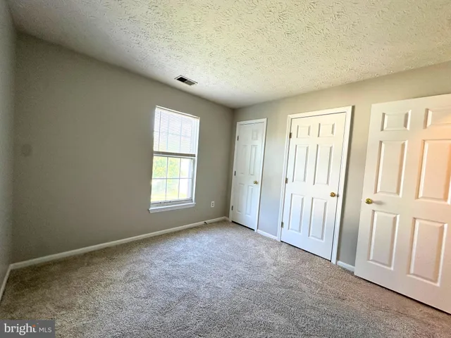 a bathroom with a sink mirror and toilet