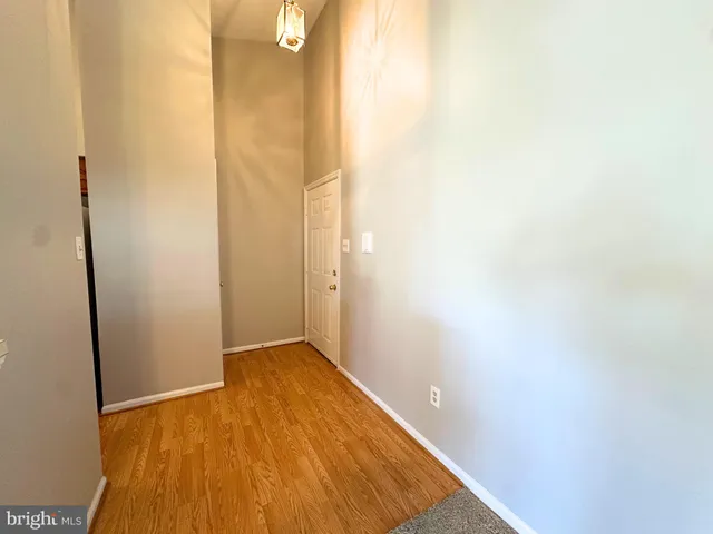 a view of kitchen with furniture and wooden floor