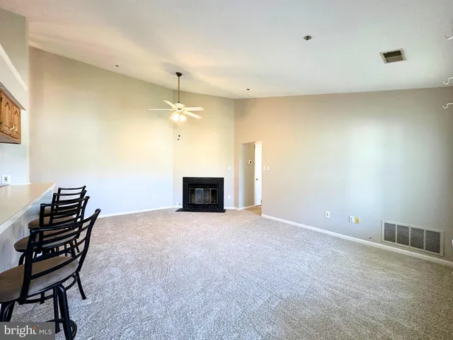 a view of an empty room with a sliding door