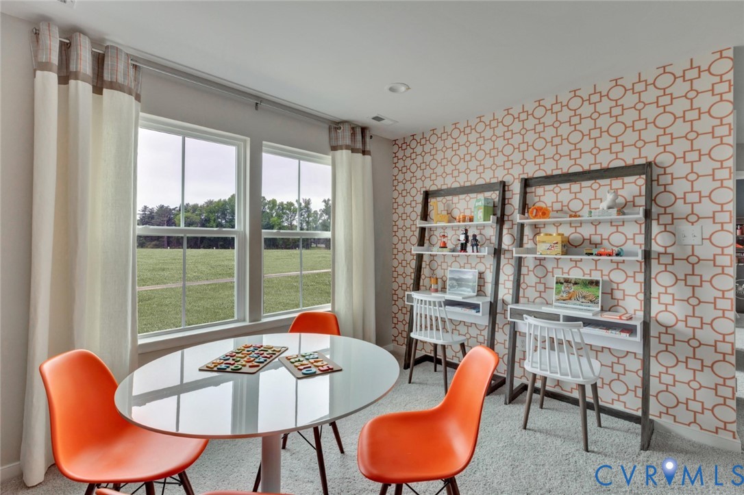 925 Charlemagne Road Midlothian, VA 23114 - Photo 18 of 43 a living room with furniture and a floor to ceiling window