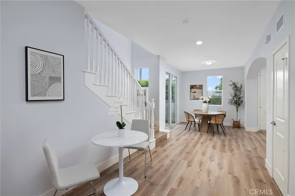 a view of a dining room with furniture and wooden floor
