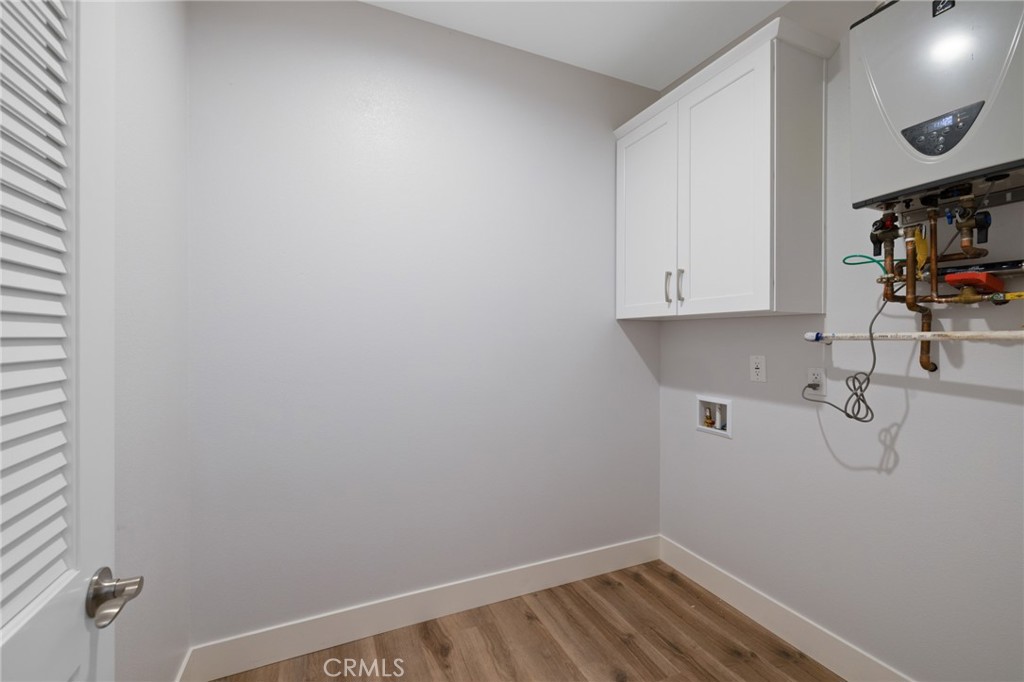 11237 Gladhill Road, Unit 4 Whittier, CA 90604 - Photo 30 of 34 a view of storage and utility room with racks on the wall