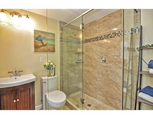 10 Emerson Road Wayland, MA 01778 - Photo 17 of 30 a bathroom with a sink toilet a mirror and shower