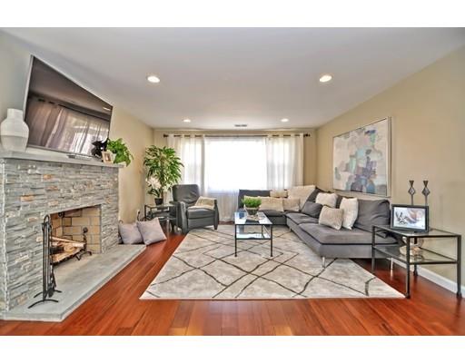 10 Emerson Road Wayland, MA 01778 - Photo 9 of 30 a living room with furniture a fireplace and a flat screen tv