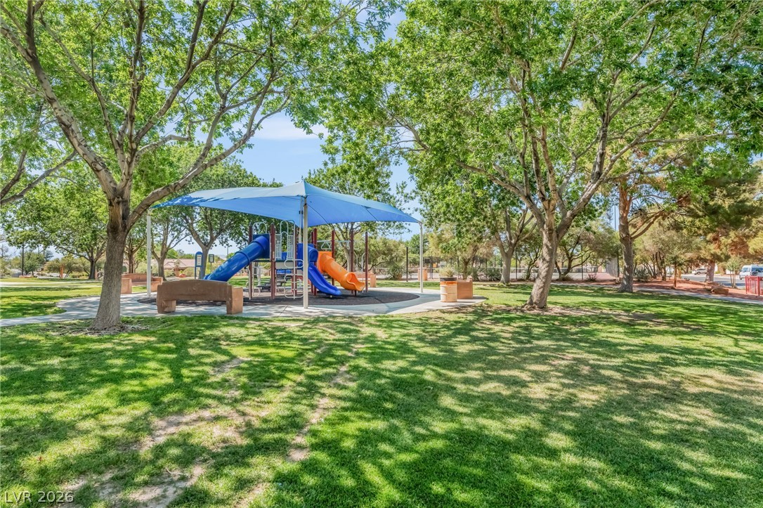 668 Rising Brook Drive Henderson, NV 89011 - Photo 22 of 22 A vibrant community playground offers endless fun beneath a shaded canopy.