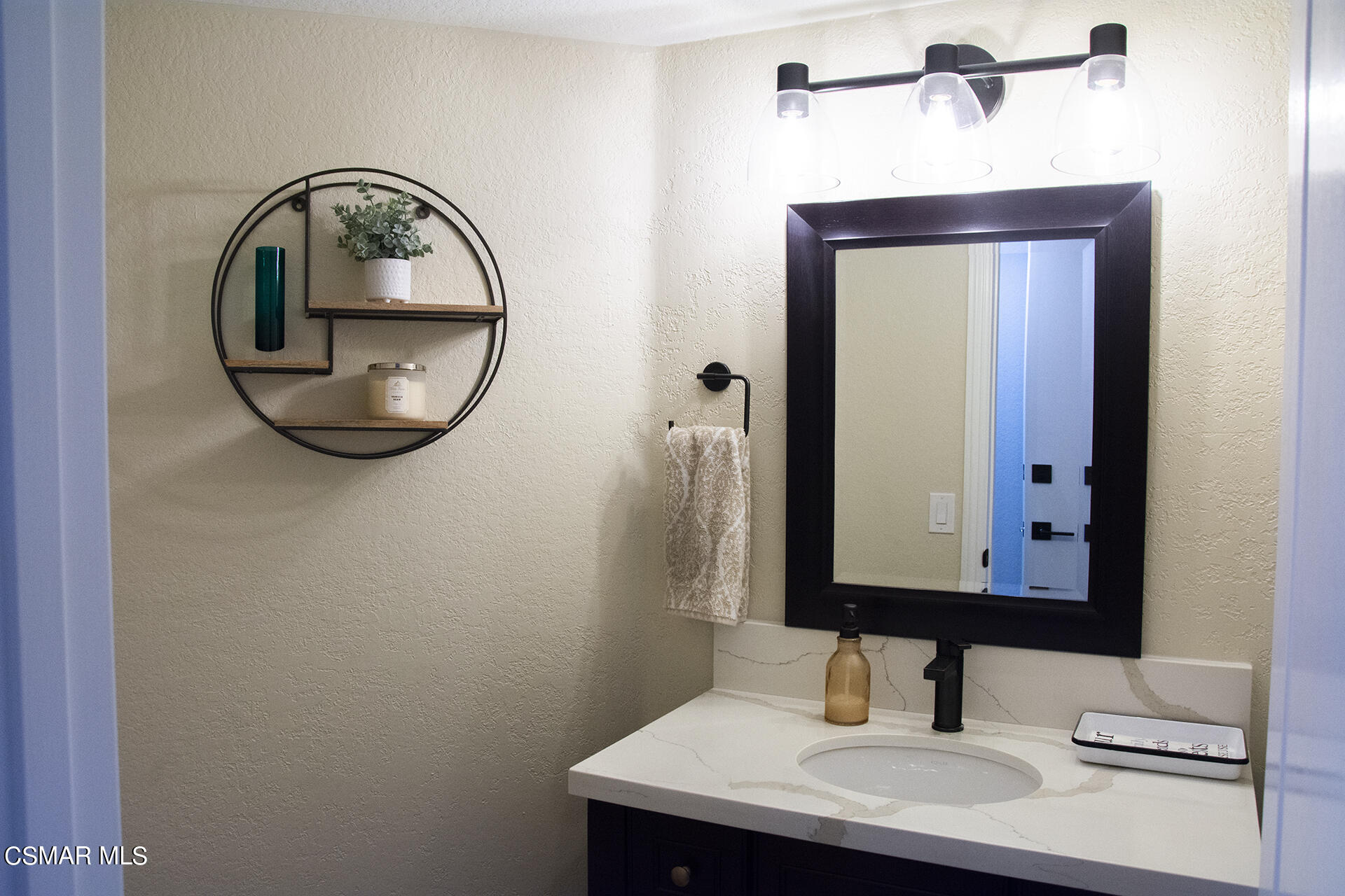 685 Overlook Road Simi Valley, CA 93065 - Photo 15 of 37 a bathroom with a sink and a mirror