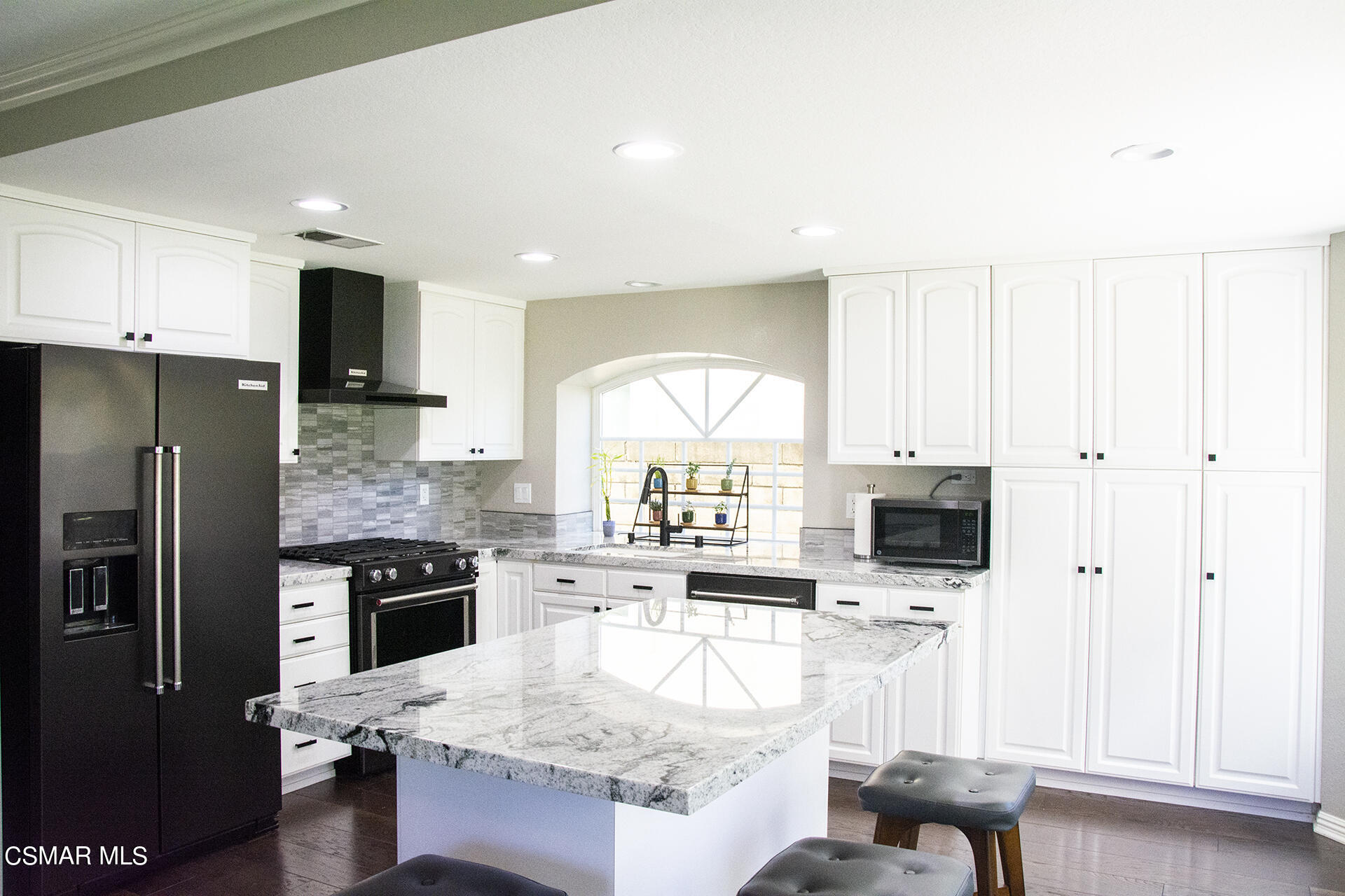 685 Overlook Road Simi Valley, CA 93065 - Photo 16 of 37 a kitchen with stainless steel appliances granite countertop a stove top oven a sink dishwasher and a refrigerator