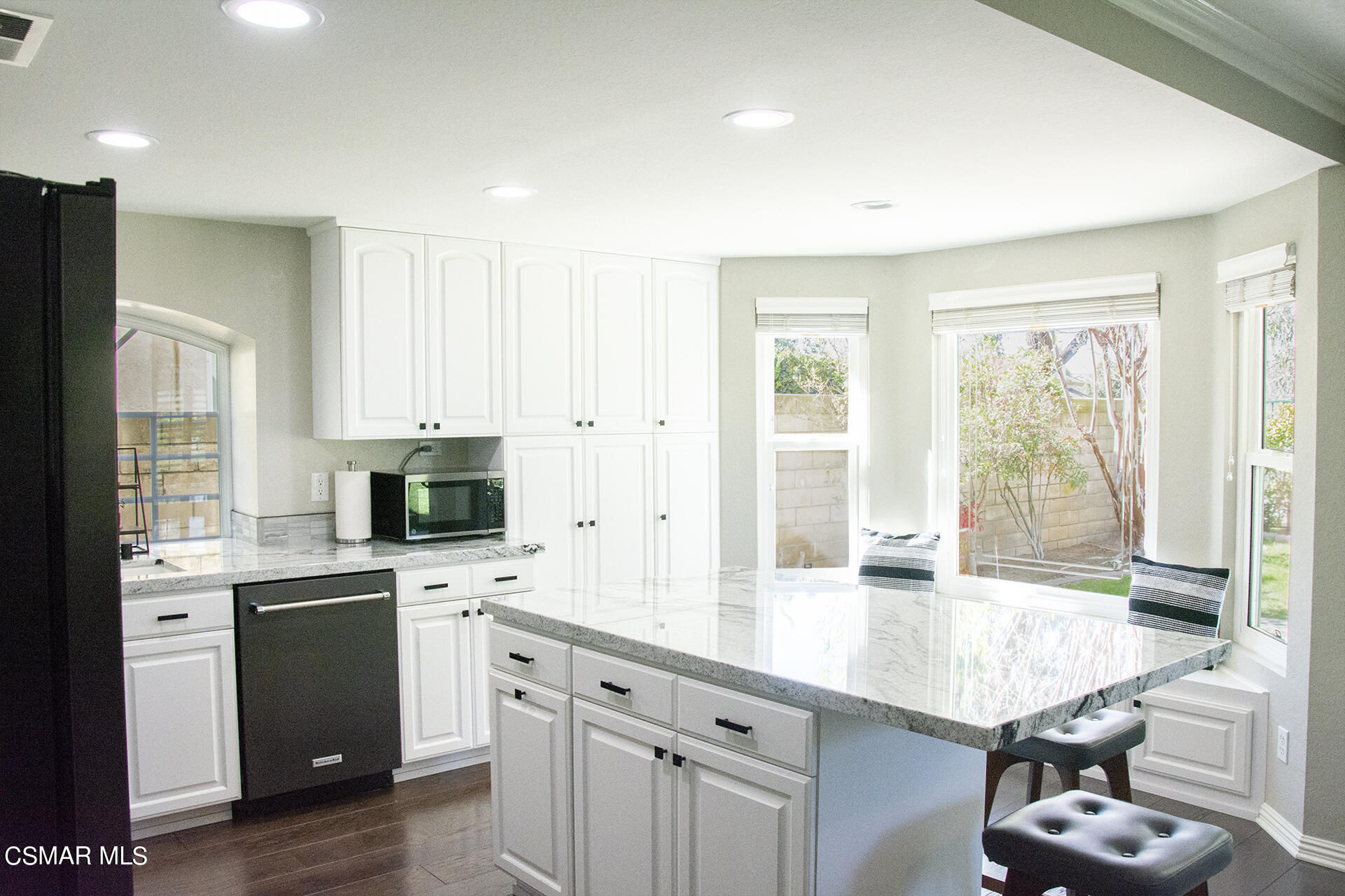 685 Overlook Road Simi Valley, CA 93065 - Photo 18 of 37 a kitchen with white cabinets and appliances