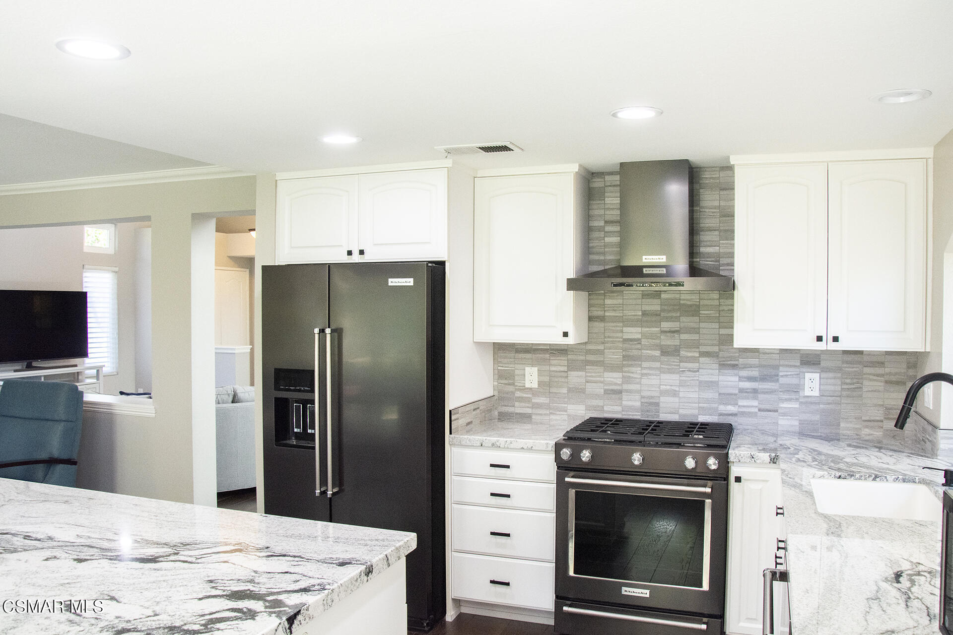 685 Overlook Road Simi Valley, CA 93065 - Photo 20 of 37 a kitchen with stainless steel appliances kitchen island granite countertop a refrigerator stove and oven
