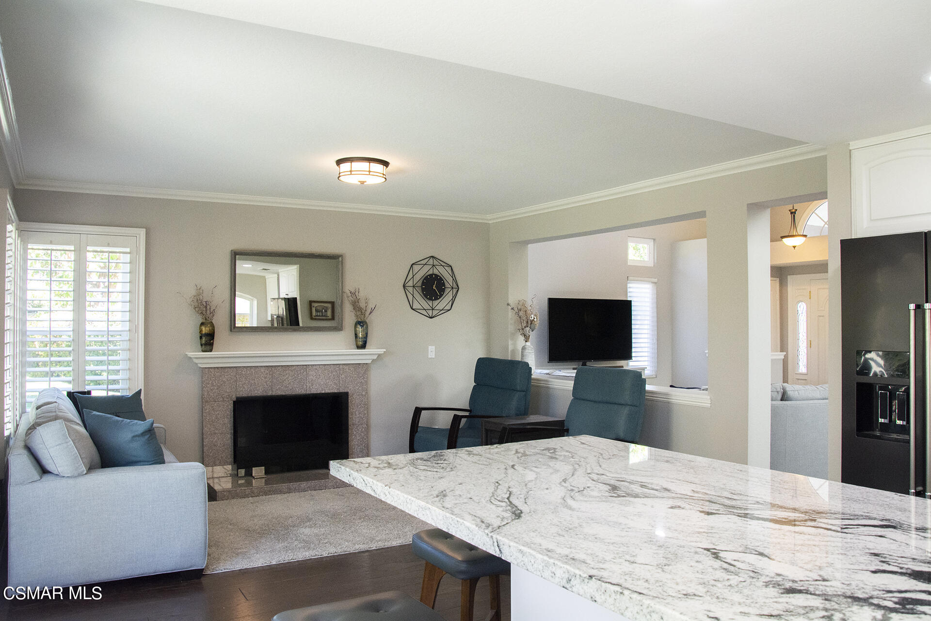 685 Overlook Road Simi Valley, CA 93065 - Photo 23 of 37 a living room with furniture a fireplace and a flat screen tv