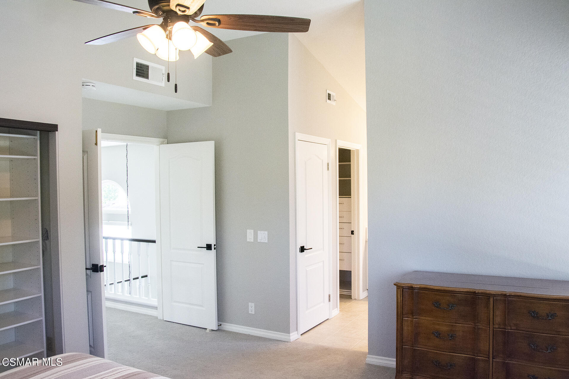 685 Overlook Road Simi Valley, CA 93065 - Photo 30 of 37 a view of an empty room with wooden floor and a ceiling fan