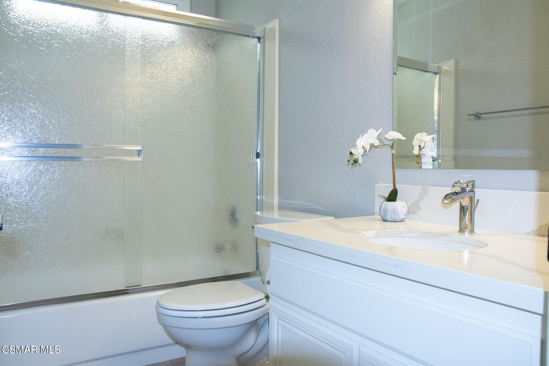 685 Overlook Road Simi Valley, CA 93065 - Photo 34 of 37 a bathroom with a granite countertop sink toilet and a mirror