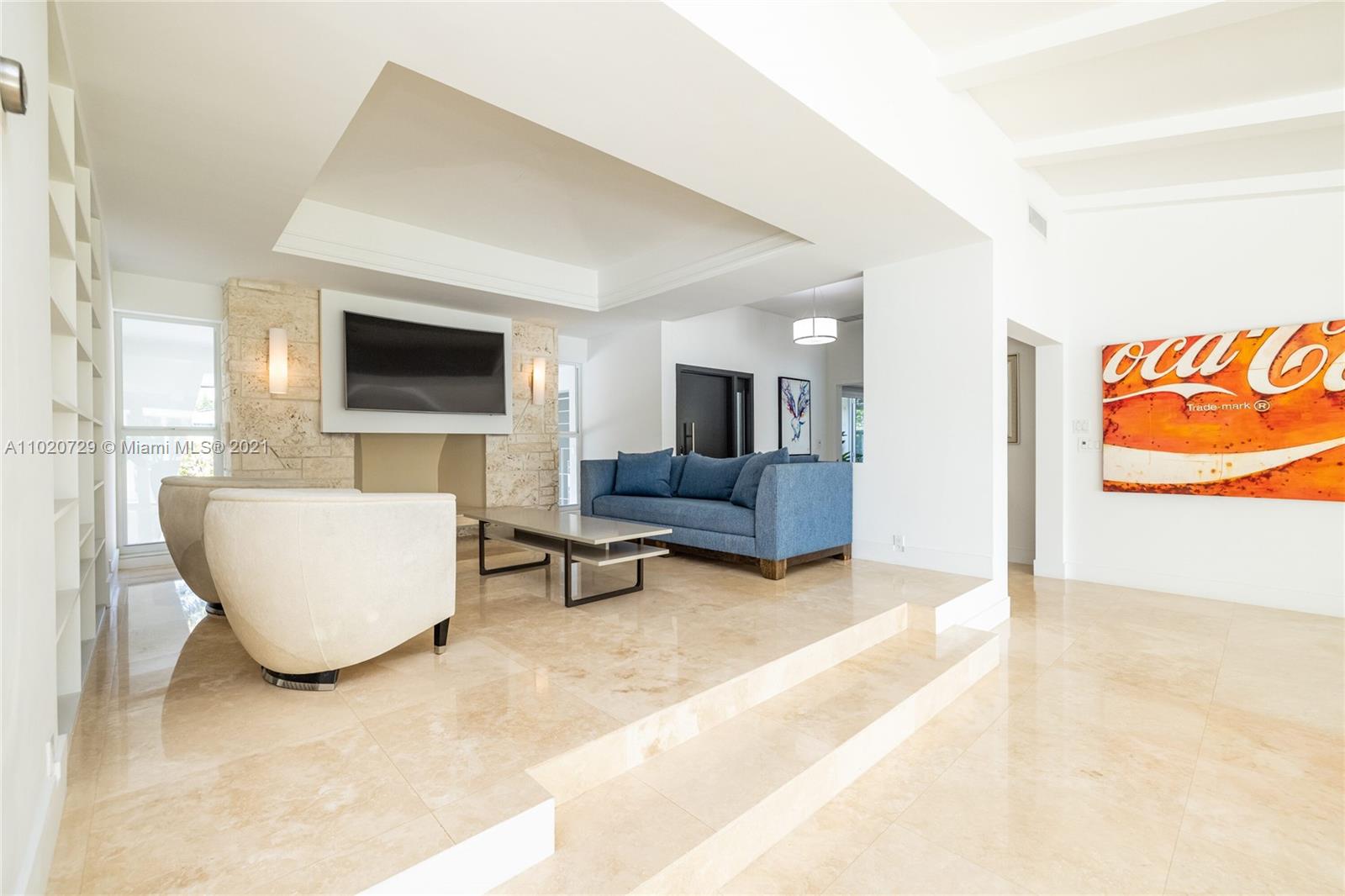 4765 Lake Road Miami, FL 33137 - Photo 11 of 100 a living room with furniture and a flat screen tv