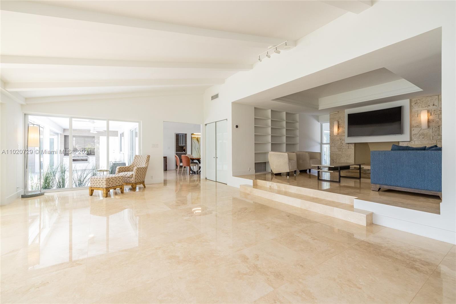 4765 Lake Road Miami, FL 33137 - Photo 17 of 100 a living room with furniture and a flat screen tv