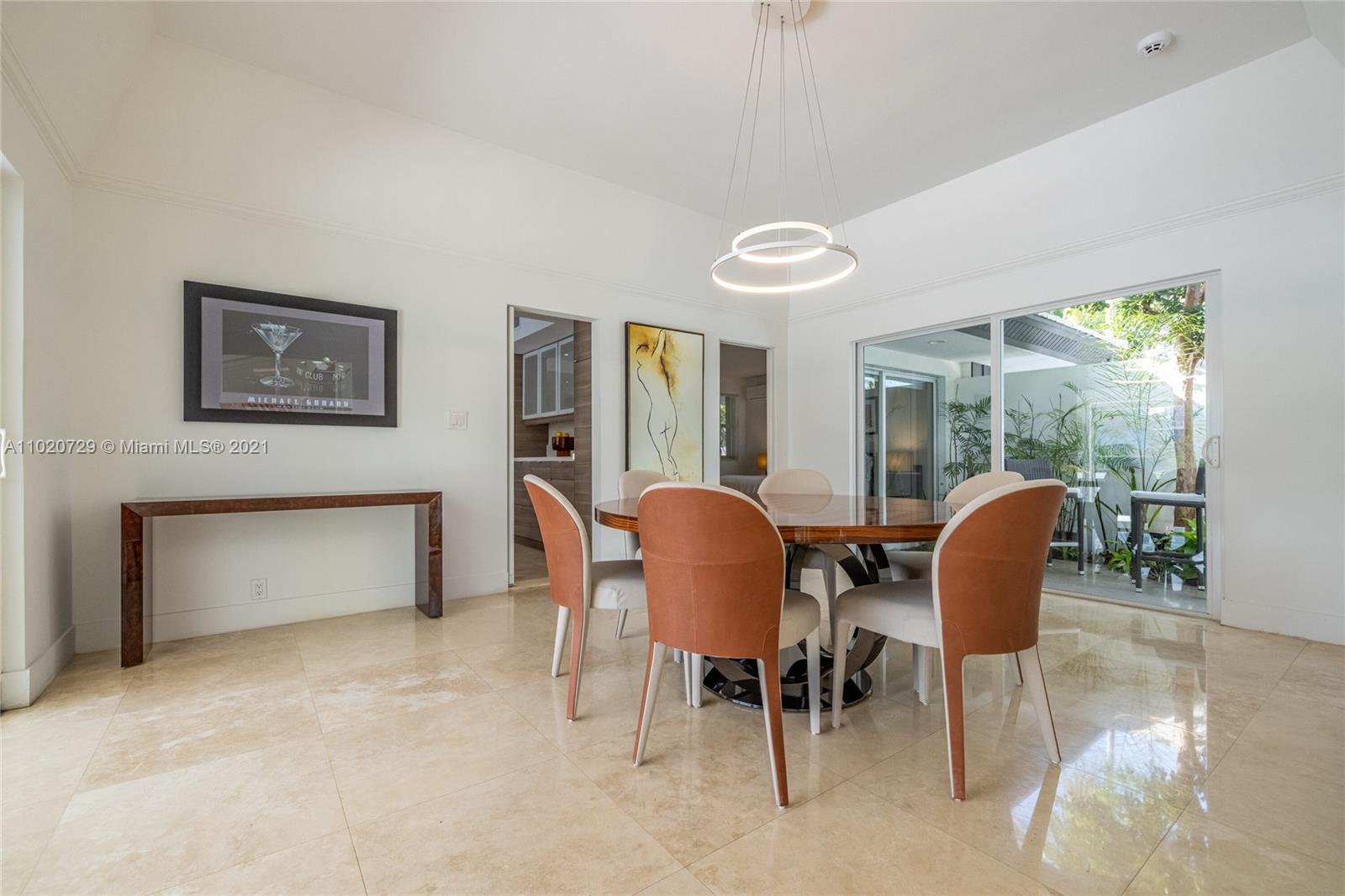 4765 Lake Road Miami, FL 33137 - Photo 20 of 100 a dining room with furniture and a window
