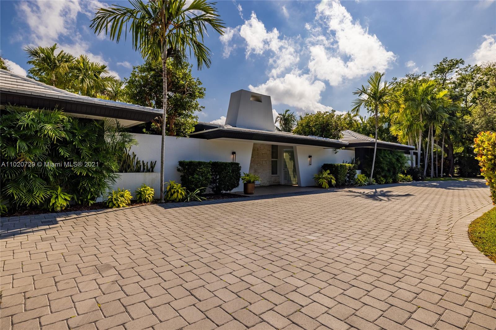 4765 Lake Road Miami, FL 33137 - Photo 2 of 100 a view of a house with a yard and potted plants