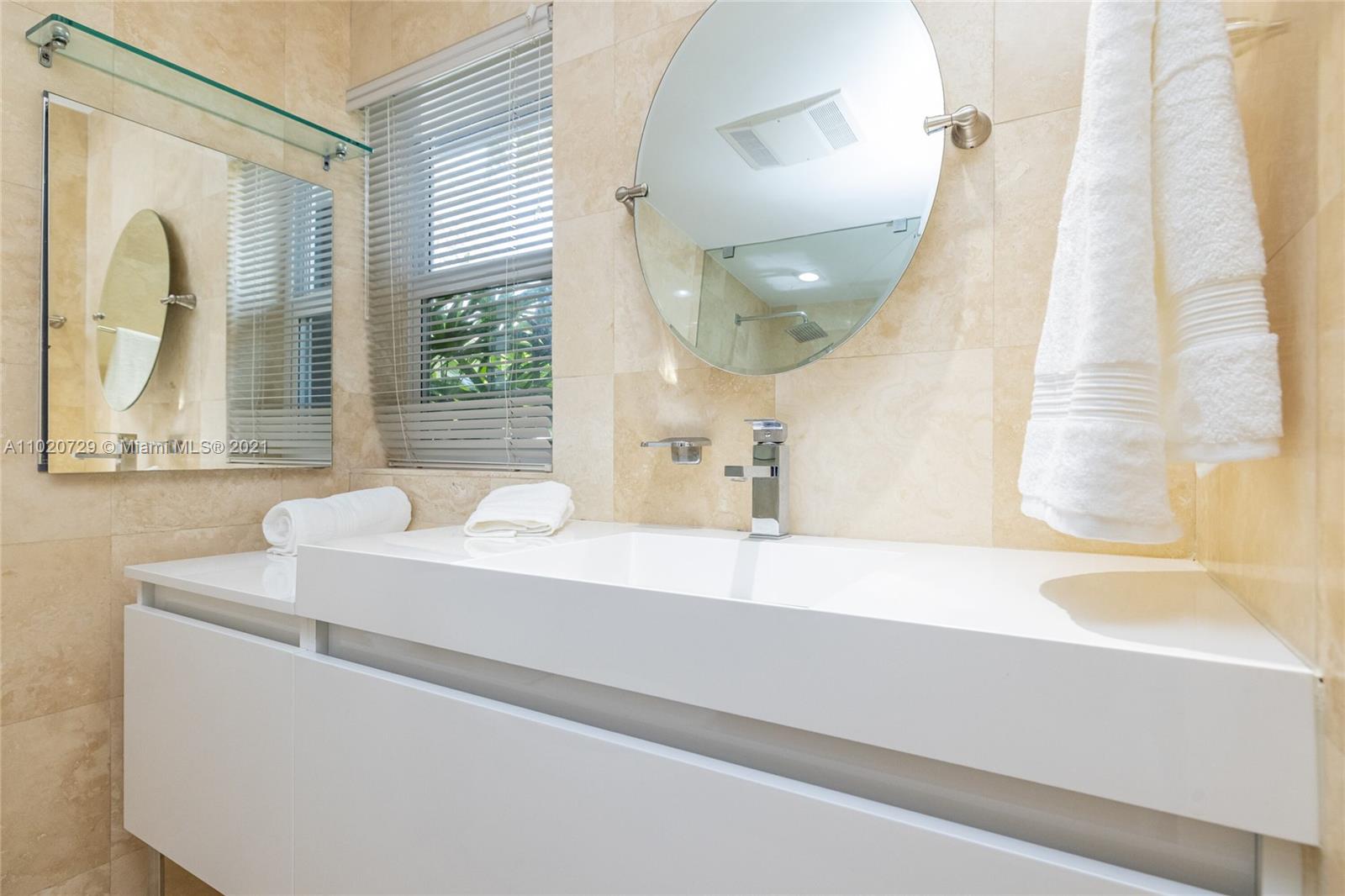 4765 Lake Road Miami, FL 33137 - Photo 26 of 100 a bathroom with a bathtub and a sink