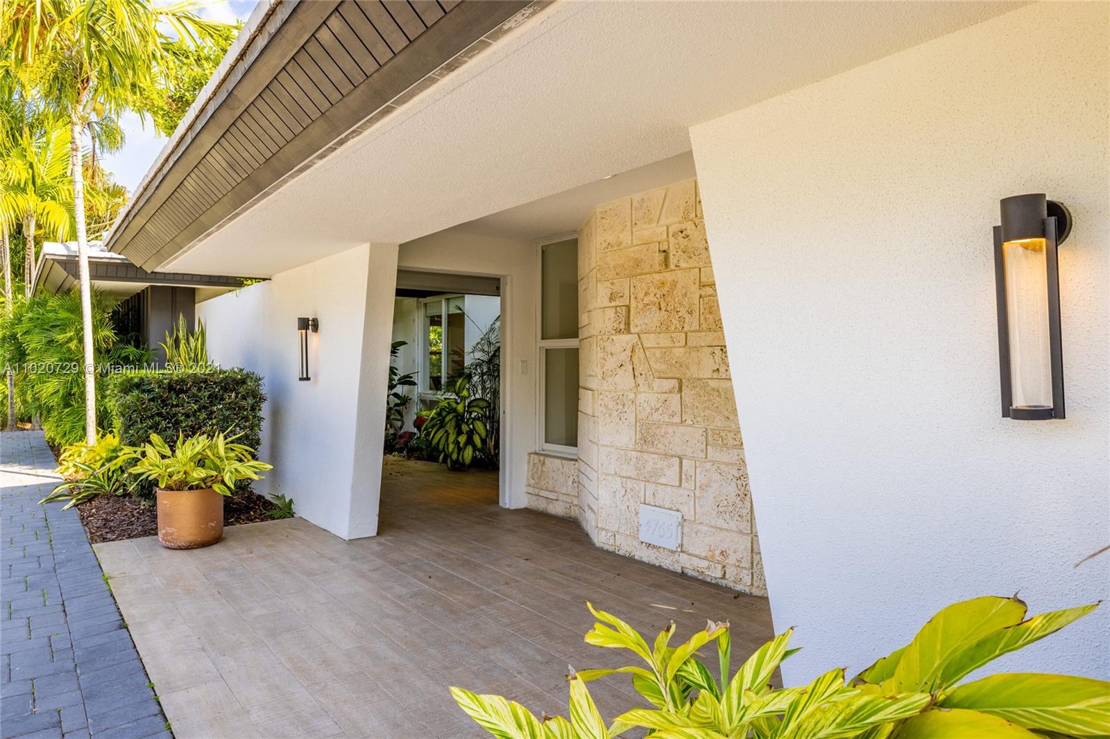 4765 Lake Road Miami, FL 33137 - Photo 6 of 100 a front view of a house with an outdoor space