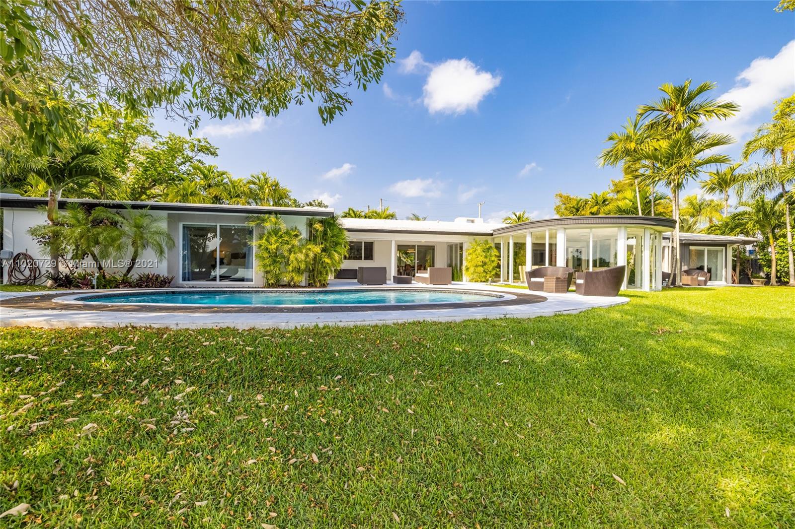 4765 Lake Road Miami, FL 33137 - Photo 71 of 100 a front view of a house with garden