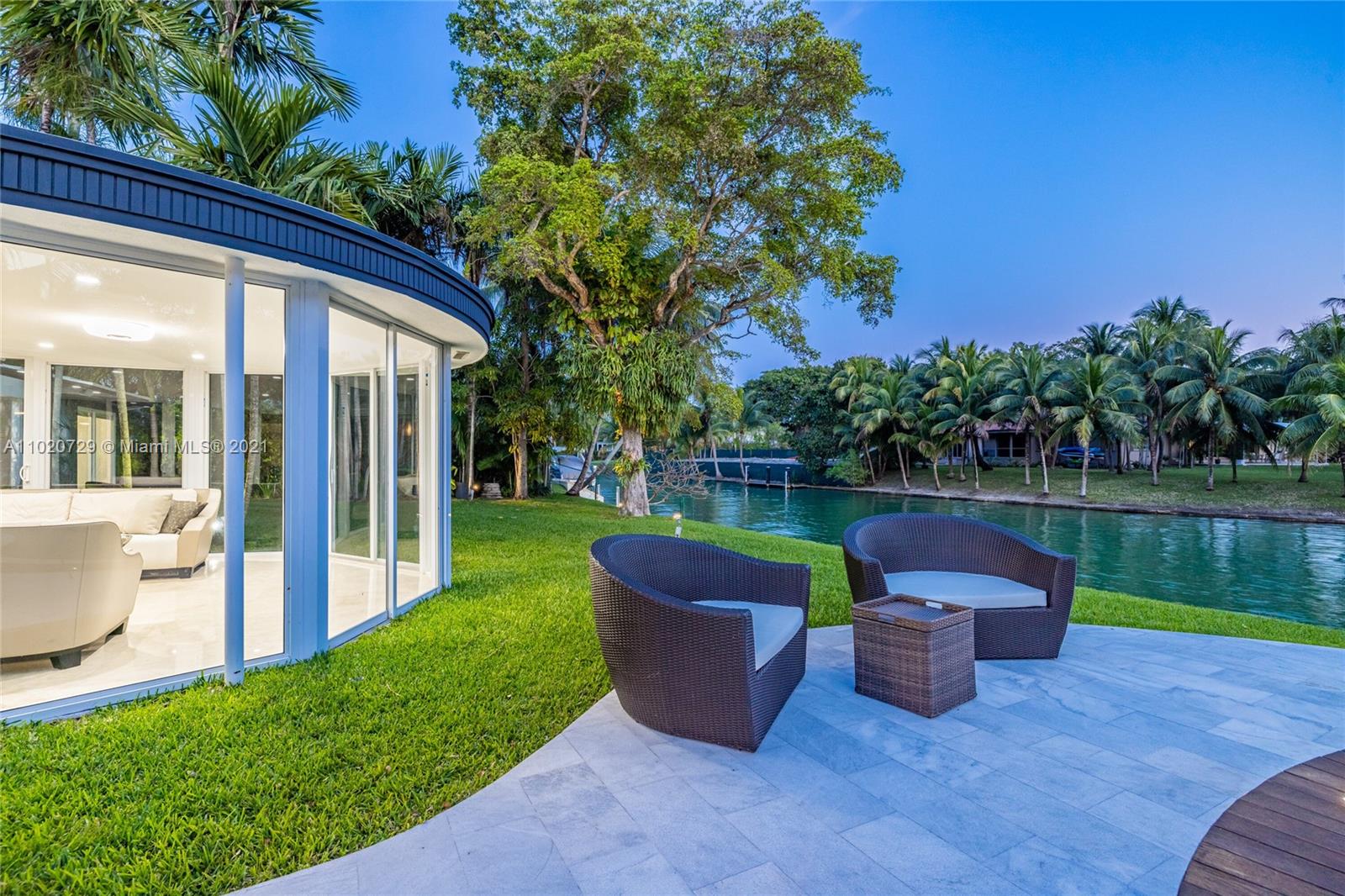 4765 Lake Road Miami, FL 33137 - Photo 78 of 100 a view of a patio with couches chairs and a table