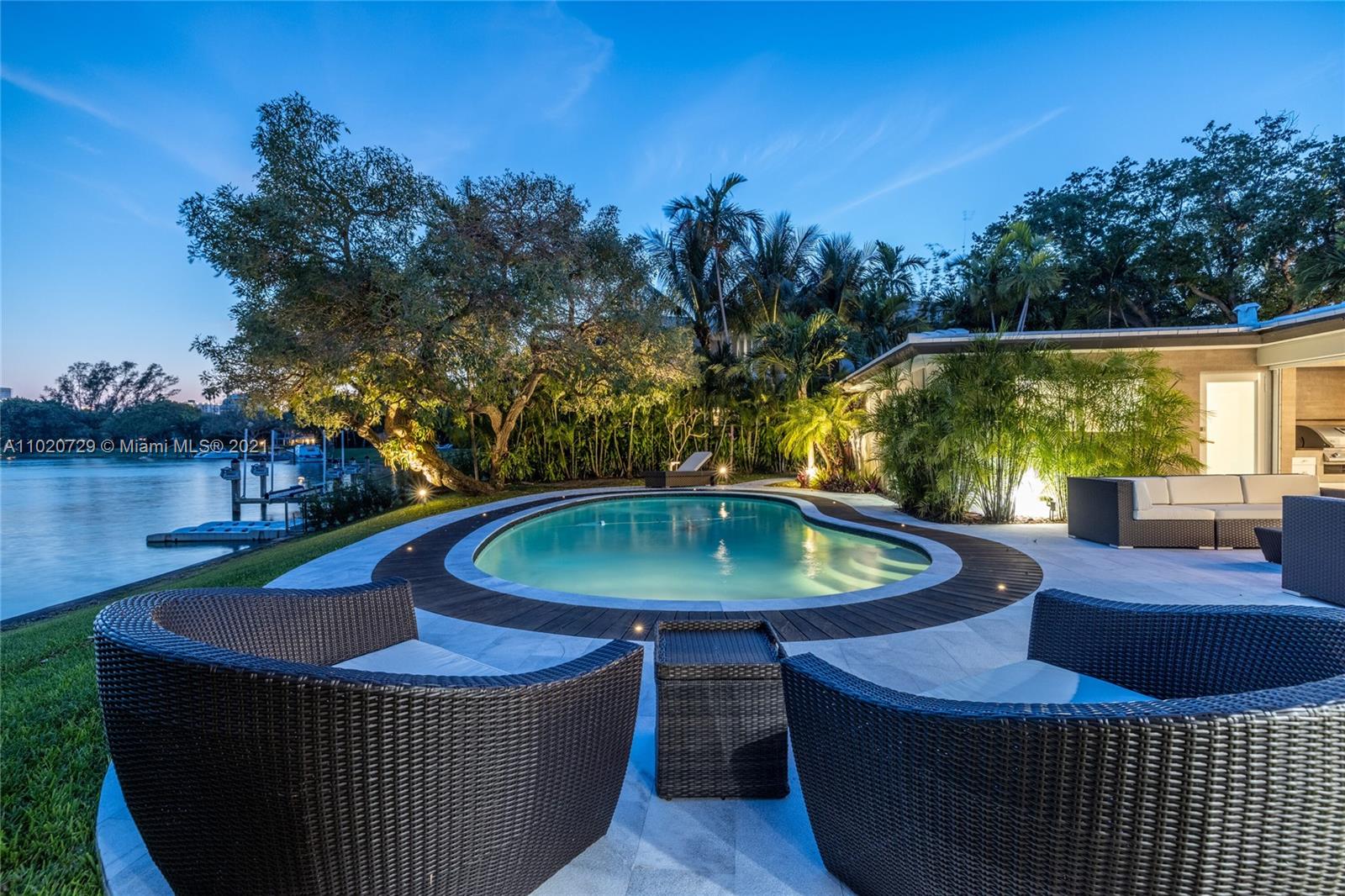 4765 Lake Road Miami, FL 33137 - Photo 88 of 100 a view of a swimming pool with a patio