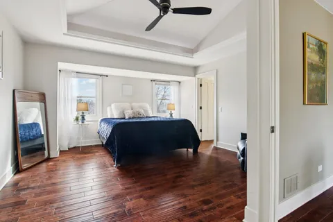 a kitchen with stainless steel appliances granite countertop a stove top oven a sink a dining table and chairs