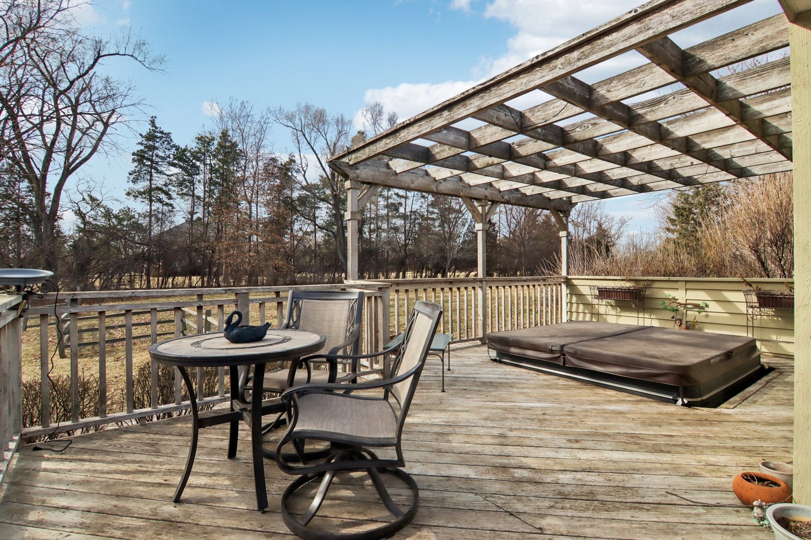 635 Signal Hill Road North Barrington, IL 60010 - Photo 45 of 69 a view of a patio with table and chairs and wooden floor