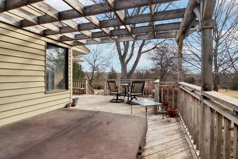 a view of a house with a yard and sitting area