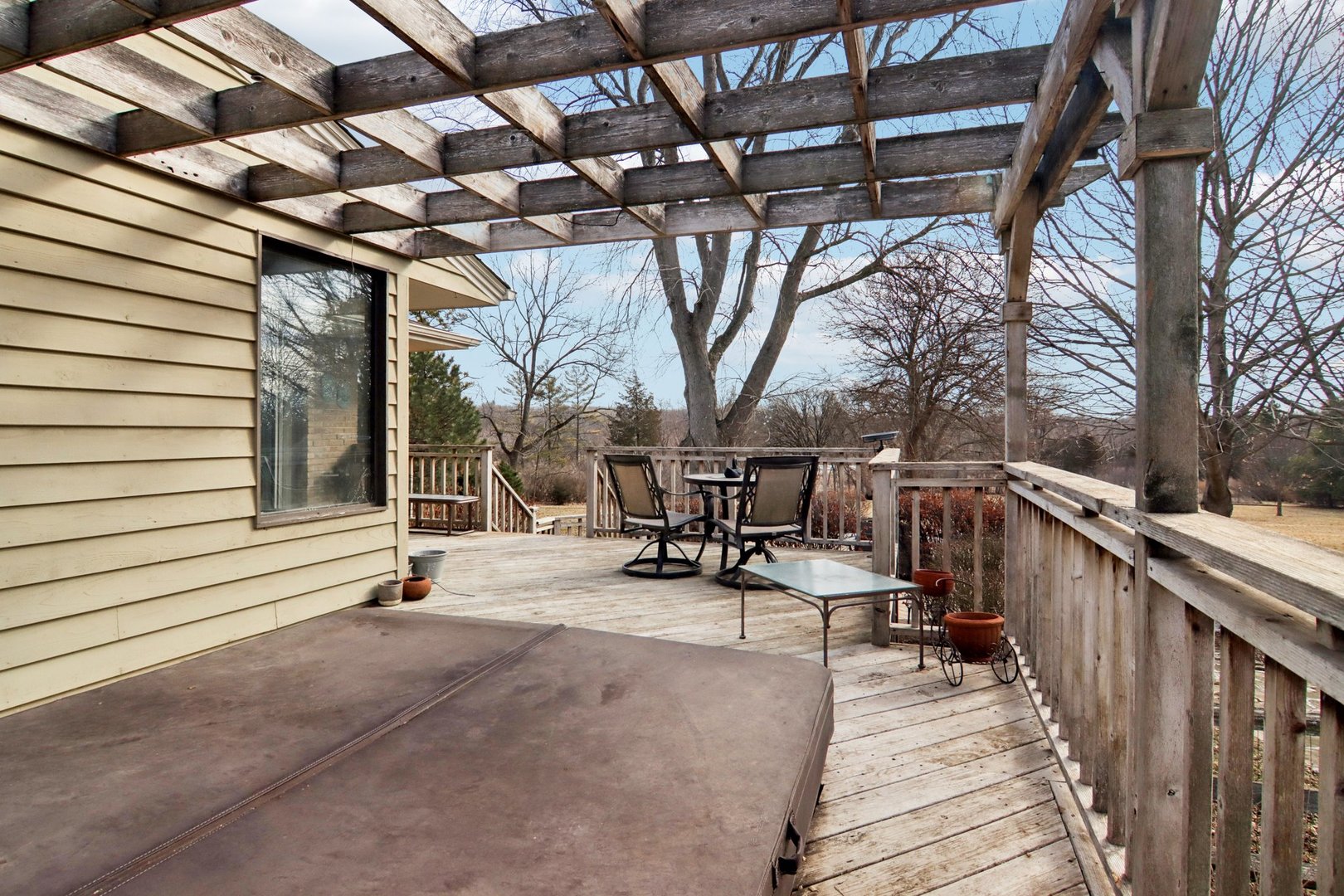 635 Signal Hill Road North Barrington, IL 60010 - Photo 46 of 69 a view of a patio with table and chairs with wooden fence and large trees