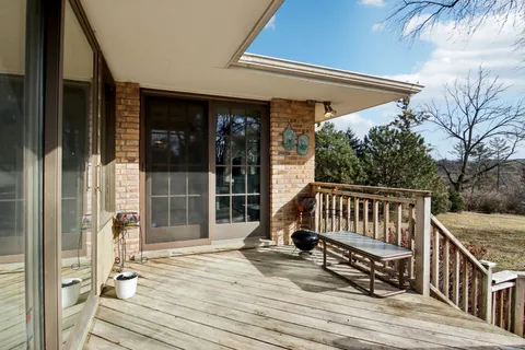 a front view of a house with a yard and entertaining space