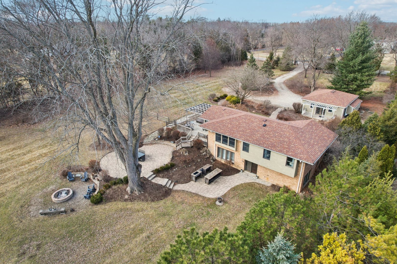 635 Signal Hill Road North Barrington, IL 60010 - Photo 51 of 69 an aerial view of a house with garden space and trees all around