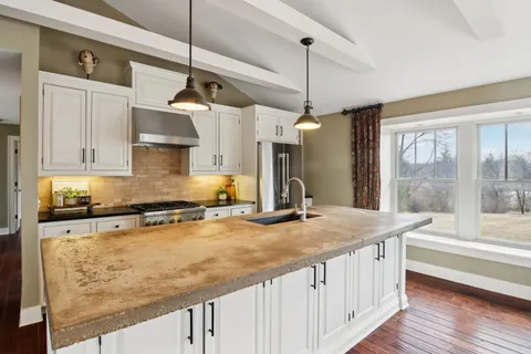 a kitchen with a stove and cabinets