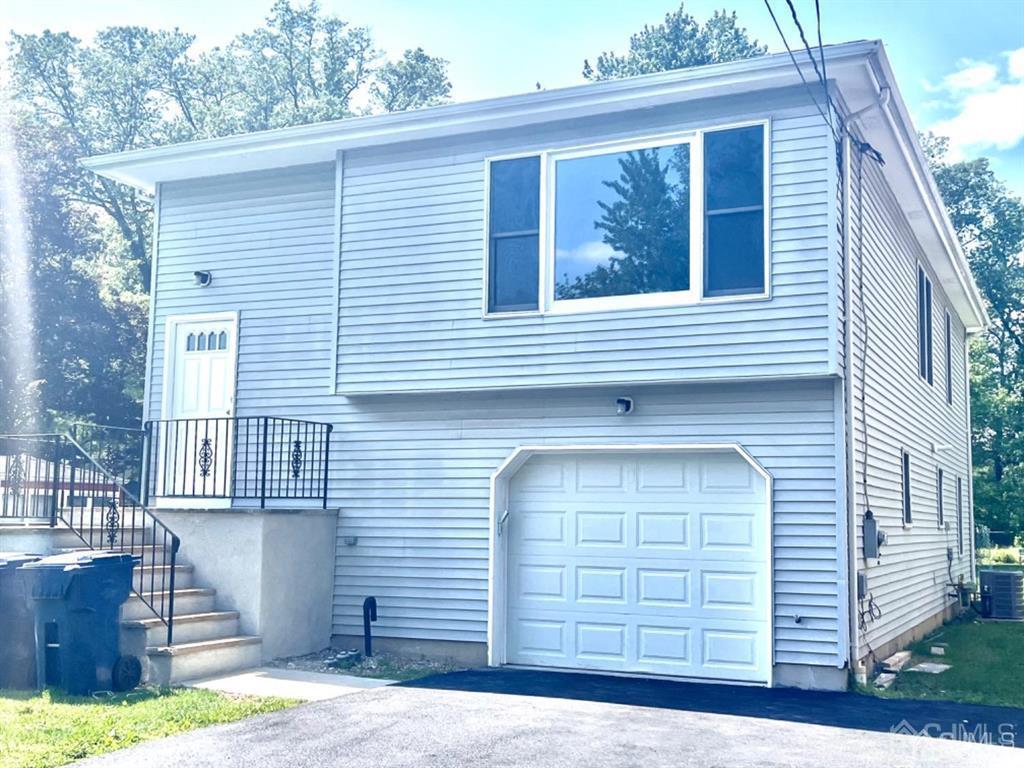 1577 Holly Road North Brunswick, NJ 08902 - Photo 2 of 15 a front view of a house