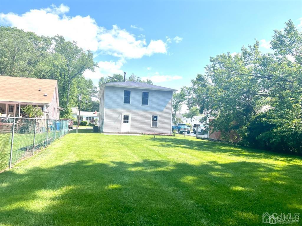 1577 Holly Road North Brunswick, NJ 08902 - Photo 4 of 15 a view of a house with a yard and sitting area